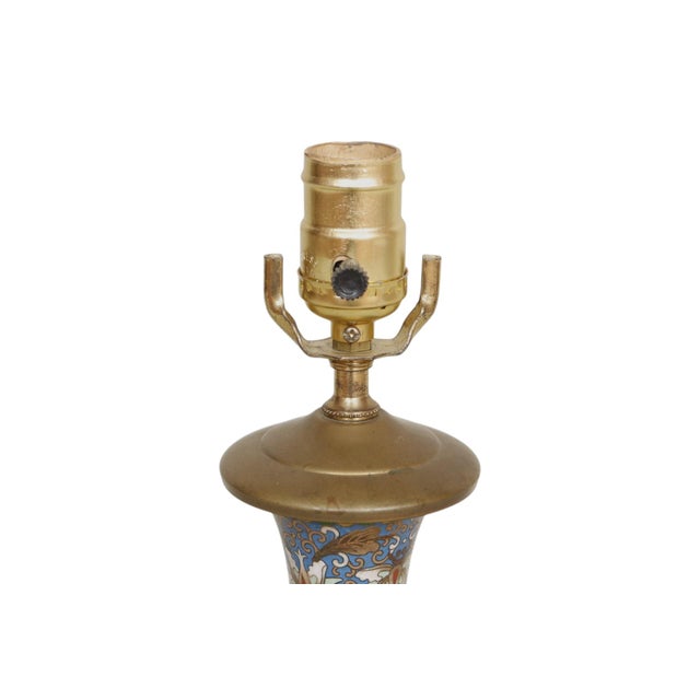 A fine 1960’s Chinese cloisonné enameled table lamp, decorated with the auspicious and joyous double dragon motif. Two...