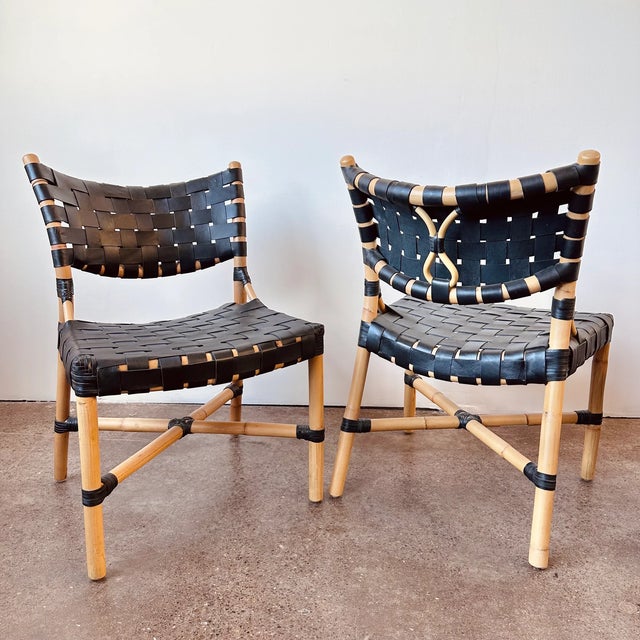 Crafted from black leather straps and natural rattan, the open weave of the Morrison Side Chair contrasts against a...