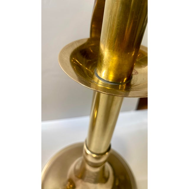 This lovely pair of Mid-Century Modern brass candle holders adds a stunning vibrance to your space. Made by Sarreid, Ltd....