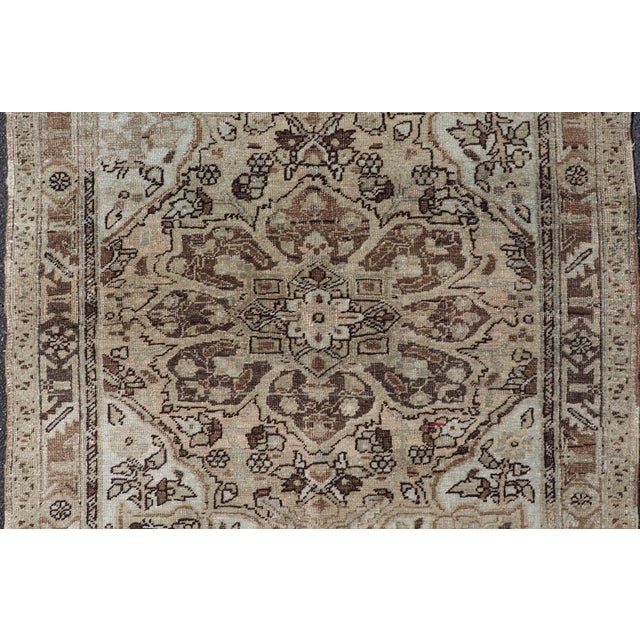 Measures: 3'10 x 4'6. Persian Heriz Rug with Large Central Medallion and Faded Earth-Tone Palette. Keivan Woven Arts /...