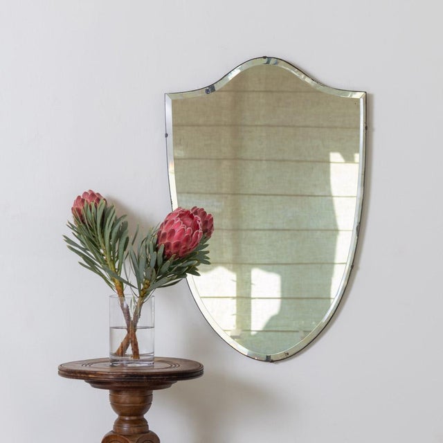 Beautiful vintage shield mirror from France, 1940s. Great shield shape with lovely curves on top and tapered bottom...
