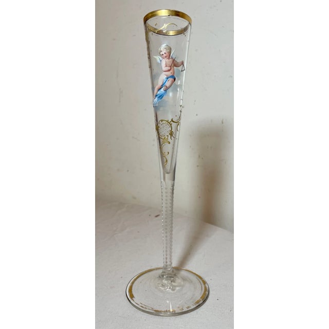 Experience the charm of antique craftsmanship with this exquisite French bud vase. The handmade glass structure is adorned...