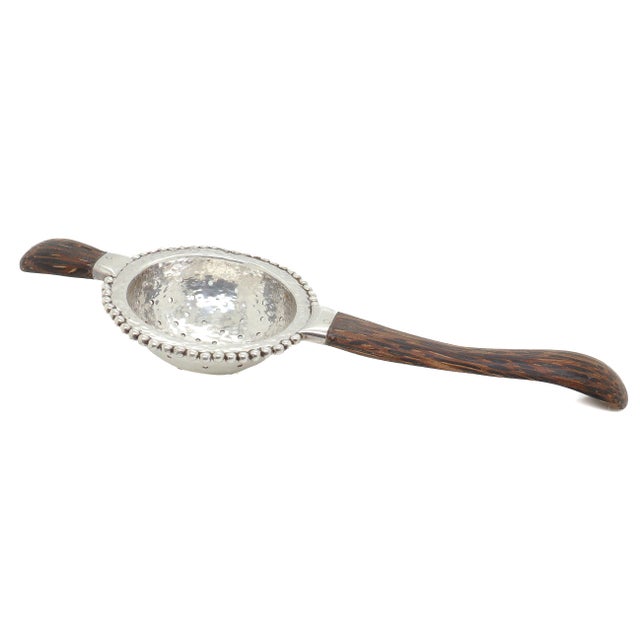 A fine vintage designer silver & wooden tea strainer. By John Hardy. In palm wood and sterling silver. Likely from Hardy's...
