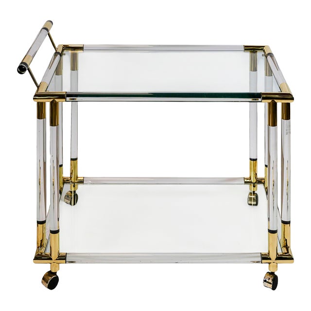 Vintage Charles Hollis Jones Style serving tray/bar on wheels in brass, acrylic glass and glass shelves. Measurements: 85...
