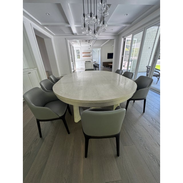 This exquisite dining table is made of rift oak and hand-planed with a lightly distressed top. Top finish: solar. The top...