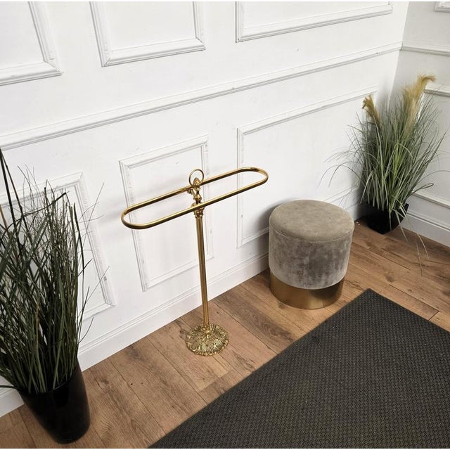 Beautiful Italian golden brass towel rack or quilt stand with decorated top and base. A great piece that perfectly adds to...