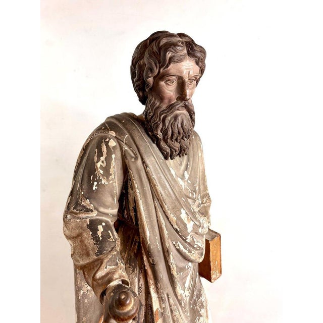 Antique statue of Saint Paul the Apostle, hand-carved from solid oak in the late 18th century. Depicted draped in a solemn...