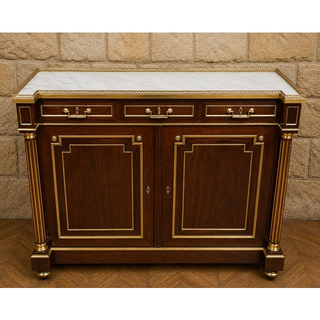 Important mahogany and gilt bronze sideboard – white marble top – louis xvi style an elegant and substantial mahogany and...