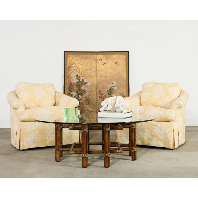 A charming pair of 20th century bespoke skirted club chairs attributed to A. Rudin San Francisco, CA. Each club chair...