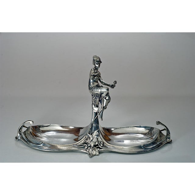 This exquisite pewter candy dish is handcrafted in Italy and features a beautifully sculpted classical female figure...