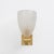 An elegant pair of italian wall lamps with hand-blown murano glass lampshades in a delicate milky white hue. The glass is...