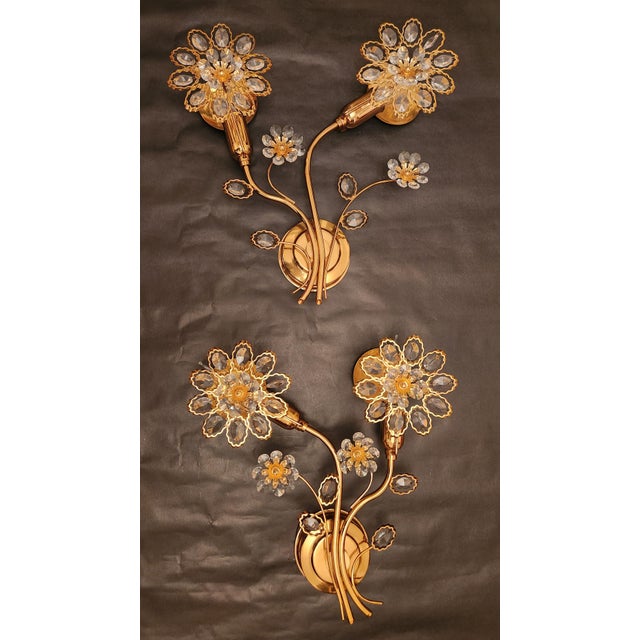 Stunning, breathtaking set of three beautiful, large wall sconces by Palwa, adorned with Swarovski flower crystals. Large,...