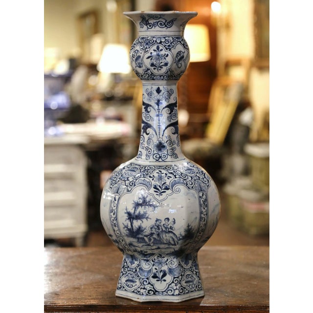 Decorate a console or buffet with this elegant antique vase. Crafted in France, circa 1880, the tall faience vase is...