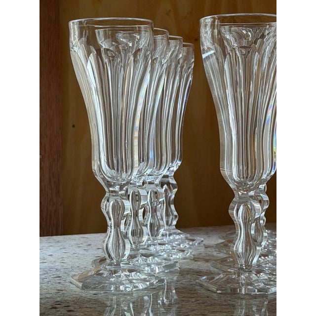 Panel-cut bowls, faceted baluster stems, hexagonal feet. Unmarked; attributed to French crystal manufacture of the period...
