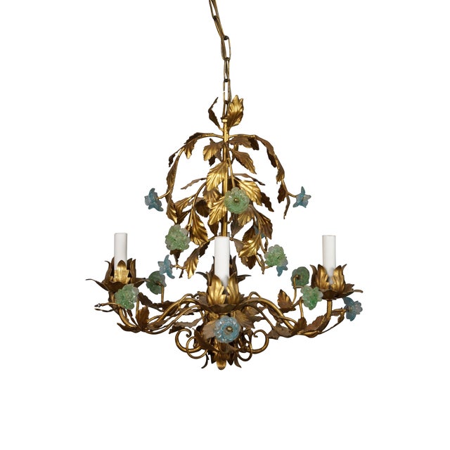 Vintage Italian Hollywood Regency Venetian Florentine Murano glass chandelier featuring gilt gold painted leaves, blue and...