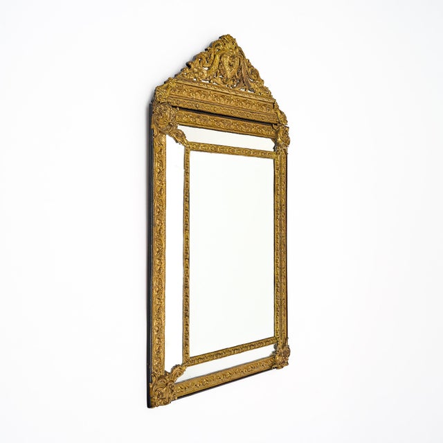 Mirror from France in the Napoleon III style. This piece is made of finely cast bronze ormolu with intricate décor...