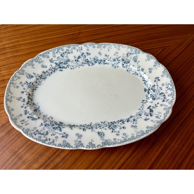 This W.H. Grindley oval serving platter in the delicate blue fern pattern is hallmarked with the Grindley backstamp used...