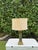 Vintage architectural table lamp featuring a tall square column with a geometric base and Greek key detail. The aged...