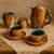 An elegant modernist tea service designed by Grandjean-Jourdan for Vallauris in the 1950s. Each piece features a...