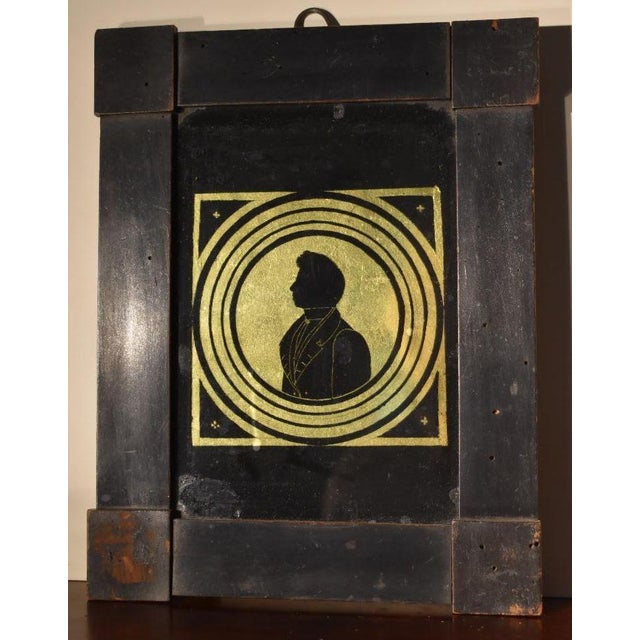 Verre eglomise' reverse painted silhouette, Continental, circa 1830s to 40s. The method was to paint the backside of the...