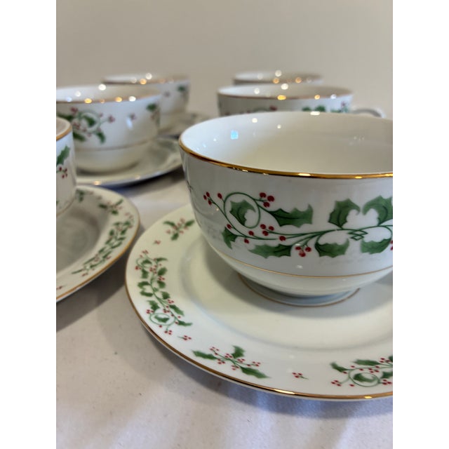 A festive vintage finds set of 6 Gibson Everyday cups and saucers in the "Christmas Holly" pattern, featuring hand-...