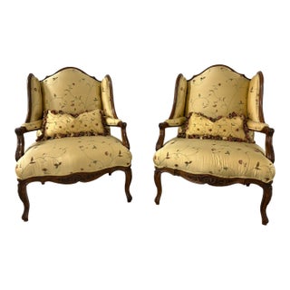 Pair of French Provincial Carved Walnut Bergeres, Late 19th Century For Sale