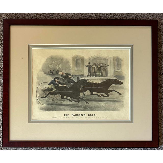 Antique Currier & Ives framed print entitled “ The Parson’s Colt “. In beautiful matte and wood frame.
