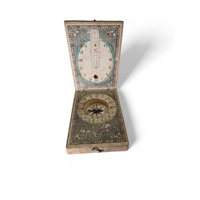 Charming portable sundial crafted in engraved wood, dating from the 19th century. This compact timekeeping instrument...