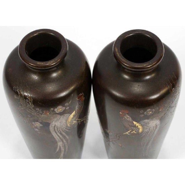 A pair of elegant vases of solid oiled bronze from the Meiji era, Japan (1868-1912). In a Classic Meiping shape, the pair...