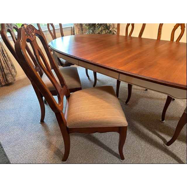 Bring timeless French Country elegance into your home with this authentic Ethan Allen Country French dining set in the...