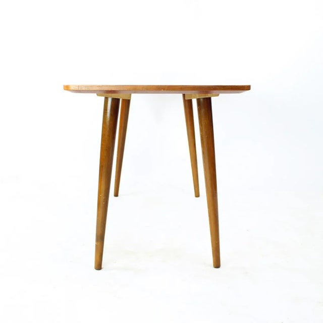 Beautiful vintage coffee table from the mid-century modern design era. Absolutely typical of the 60s designs. The table is...