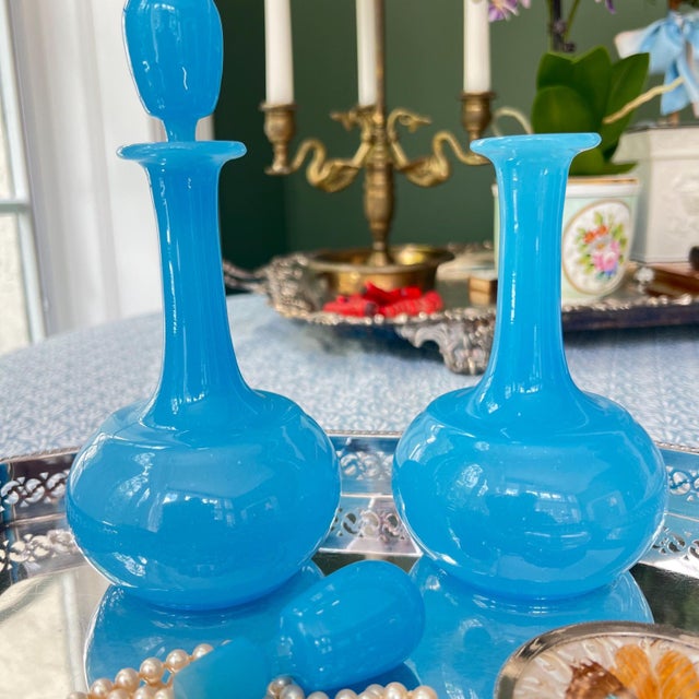 This is a beautiful pair of antique French opaline glass decanters in a gorgeous blue. It is so rare to find these with...