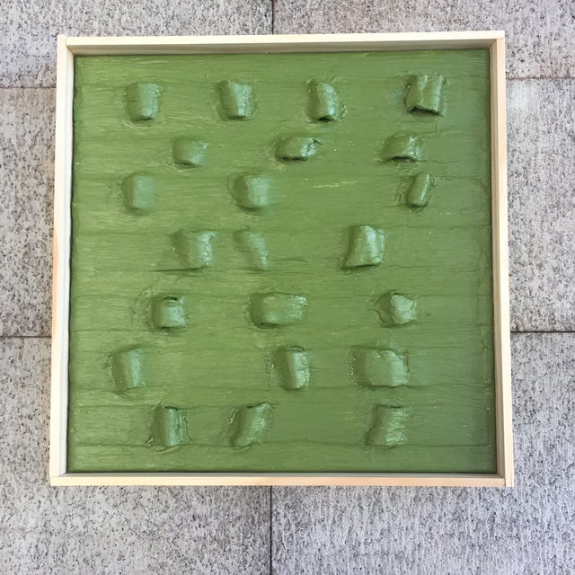 At ease, soldier. Minimalist topographical olive green plaster painting with simple wood frame. Layers and layers upon...