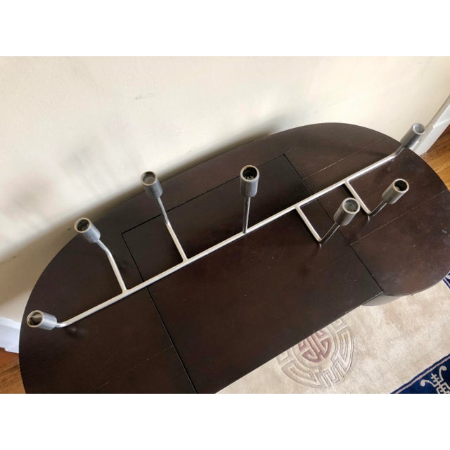 Large modern stainless steel candelabra.