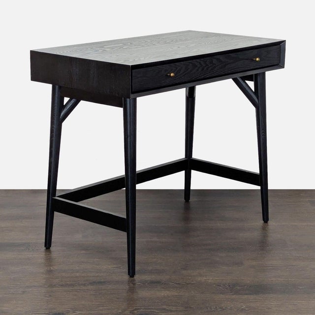 This modern black wooden desk features a clean, minimalist design perfect for any home or office. It comes with a spacious...