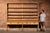 Large-scale pine farmhouse dresser or hutch constructed in two parts, featuring an expansive open plate rack above a long...