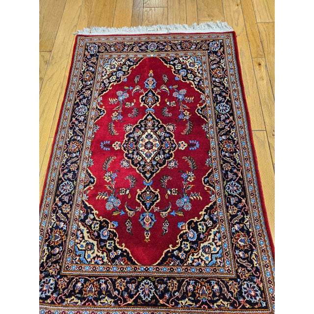 "A beautiful vintage Persian Kashan area rug from the second quarter of the 20th century, hand-knotted with the luminous...