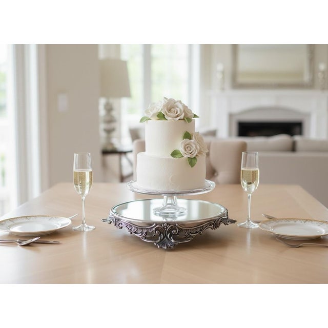 Art Nouveau style silver framed beveled mirror plateau elevated to enhance the presentation of any display.