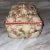 Vintage seashell encrusted box that is lined in red velvet. Decorated with an assortment of shells arranged in a low-...