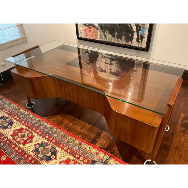 Fantastic Arezzo desk by Alfonso Marina in a mid-century style. The desk is in a Varde 85 finish and made of beautiful Koa...