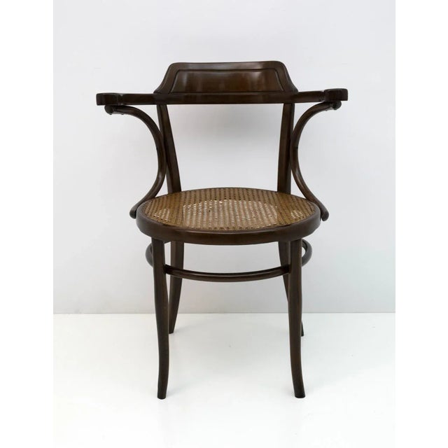 Office chair produced by Jakob & Josef Kohn, model n. 704, in curved beech and a straw seat of the original Vienna of the...