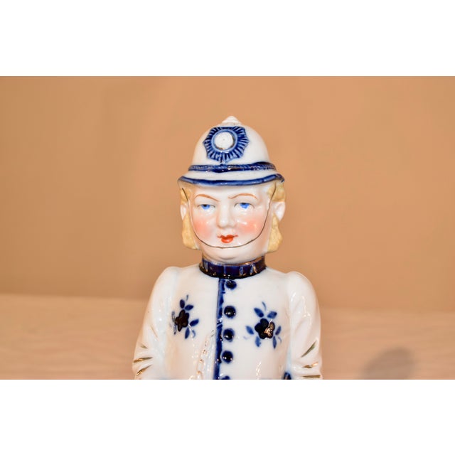 19th century flow blue figure of an English policeman or "Bobby" as they're called. the detailing is lovely and the...