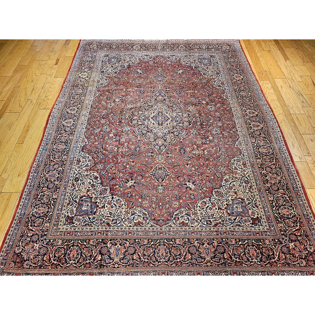 "This exquisite Early 20th Century Persian Kashan Rug features a classic Kashan ""garden"" floral pattern, meticulously...