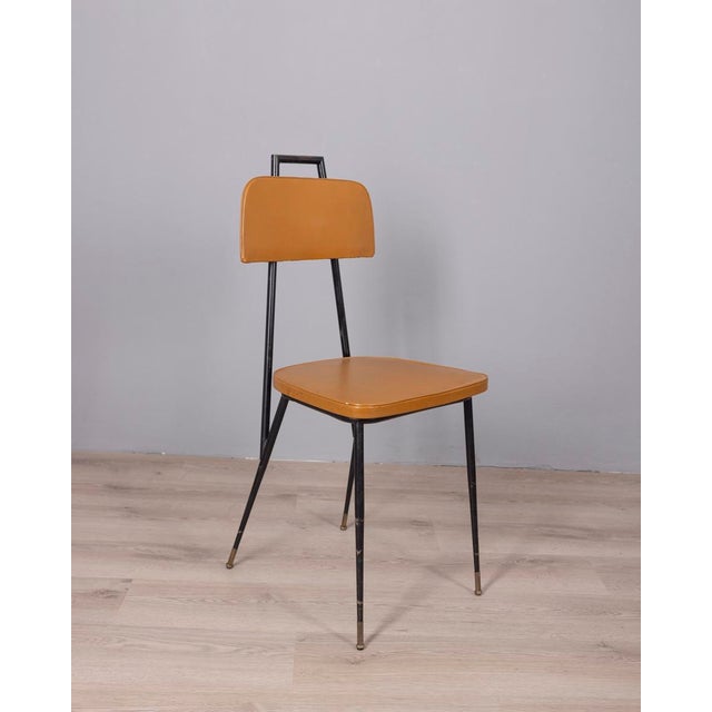 Set of six chairs with black metal frame and gold-plated brass feet, upholstered in brown faux leather, Italian design,...