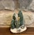 Bring the cozy charm of an old-world winter forest into your home with this entirely handcrafted holiday vignette by Felt...