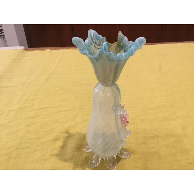 This is a truly beautiful blown glass vase. The color is light opal blue with a soft rose colored flower at the front of...
