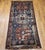 This antique Caucasian Kazak rug from the late 19th century features a bold and balanced triple medallion design set...