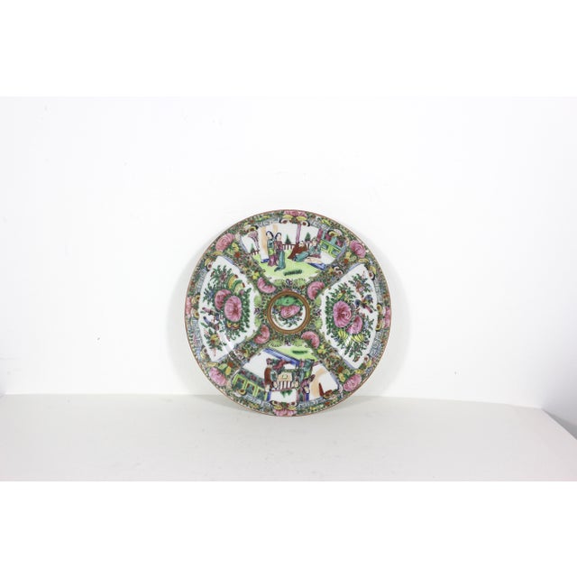 Vintage Chinese hand painted Famille Rose Medallion plate. This has people, birds and butterflies. There are some small...