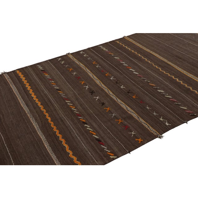Made with handwoven wool and originating from Morocco circa 1950-1960, this 5x10 vintage Moroccan kilim and runner rug is...