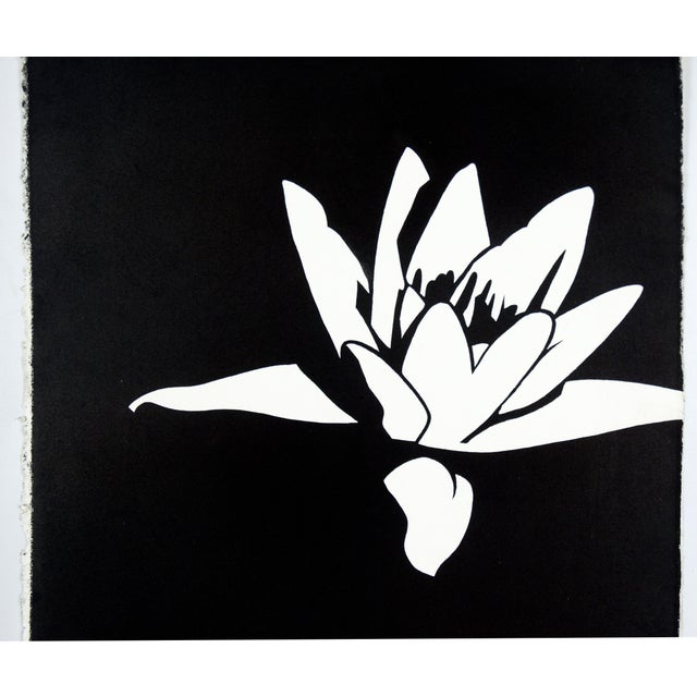 Bold black and white print by David Mar (American, 20th Century). A white lily is formed from the negative space of the...